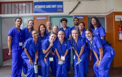 A group of people wearing blue scrubs, possibly in a hospital setting, suggesting a medical internship Kenya.